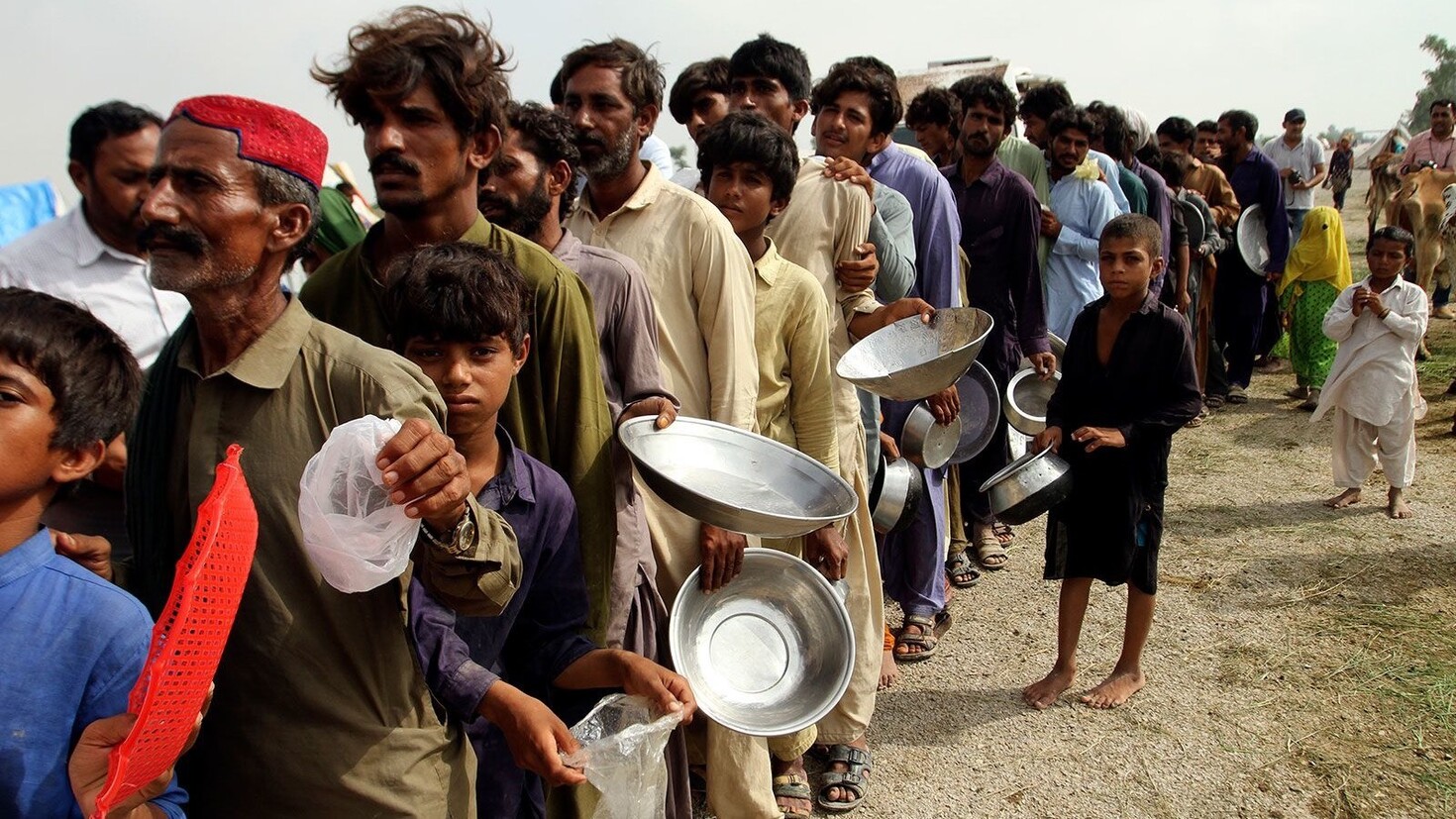 Pakistani-people-standing-in-a-line-waiting-to-get-some-food-These-people-are-facing-anxiety-and.jpg