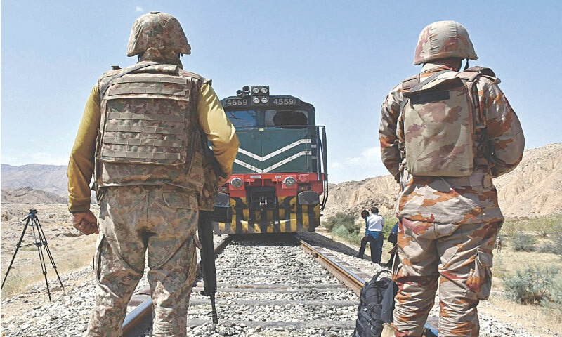 Pakistan’s Frontier Corps stand guard at the siege site after armed militants ambushed the Jaffar Express in the remote mountainous area of Pehro Kunri in Balochistan: just like it is crucial for Balochistan to get authentic political representation, it is also important to go after terrorist groups responsible for such attacks | AFP