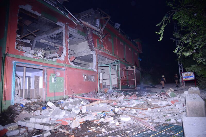 Army soldiers examine a building damaged by a suspected Indian missile attack near Muzaffarabad, the capital of Pakistan controlled Kashmir, on, May 7.