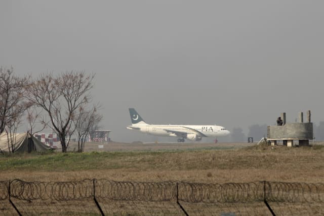  A Pakistan International Airlines (PIA) passenger plane prepares to take off from the Benazir International airport in Islamabad, Pakistan, February 9, 2016.  (photo credit: REUTERS/FAISAL MAHMOOD/FILE PHOTO)
