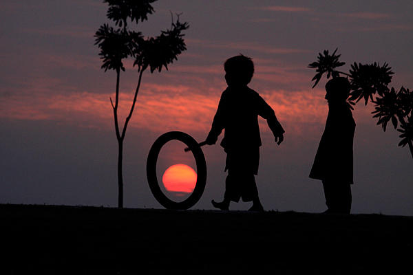 pakistanni-child-playing-at-sunset.jpg