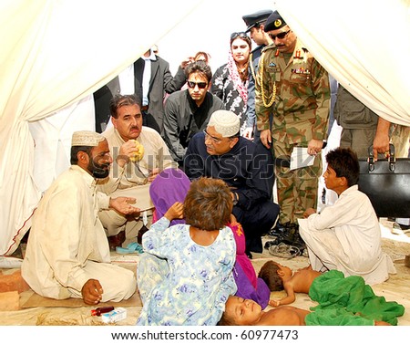 stock-photo-dera-murad-jamali-pakistan-sept-president-asif-ali-zardari-c-commiserates-with-a-flood-60977473.jpg