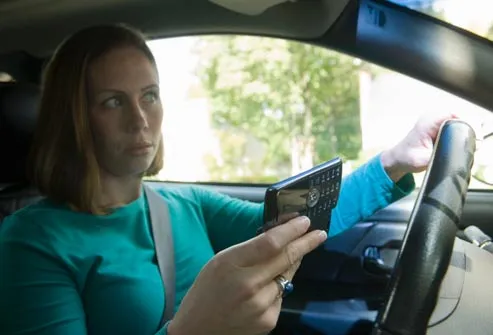 getty_rm_photo_of_woman_texting_while_driving.jpg