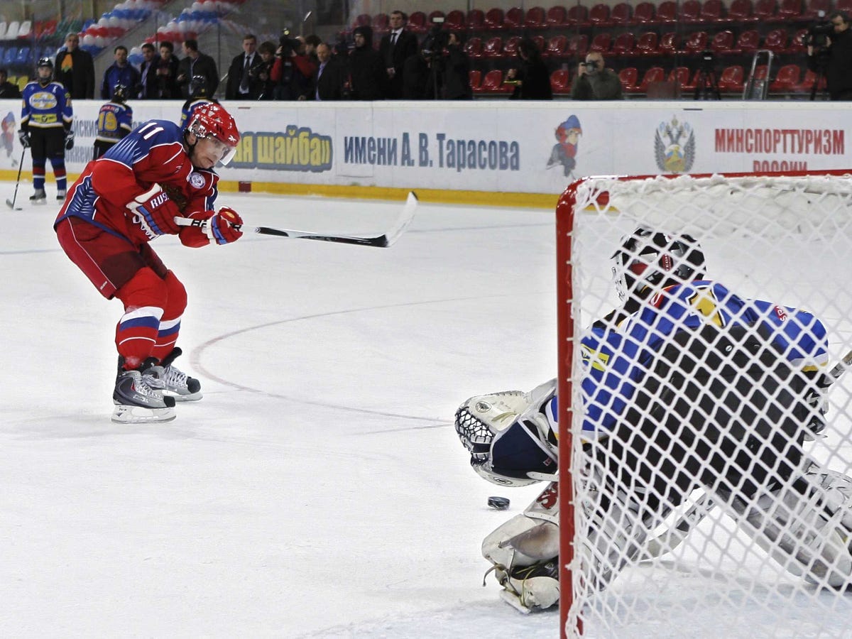 putin-makes-a-slap-shot-right-before-a-youth-ice-hockey-tournament-putin-picked-up-the-sport-after-promising-the-russia-mens-junior-ice-hockey-team-hed-learn-it-following-their-win-in-the-2011-world-tournament.jpg