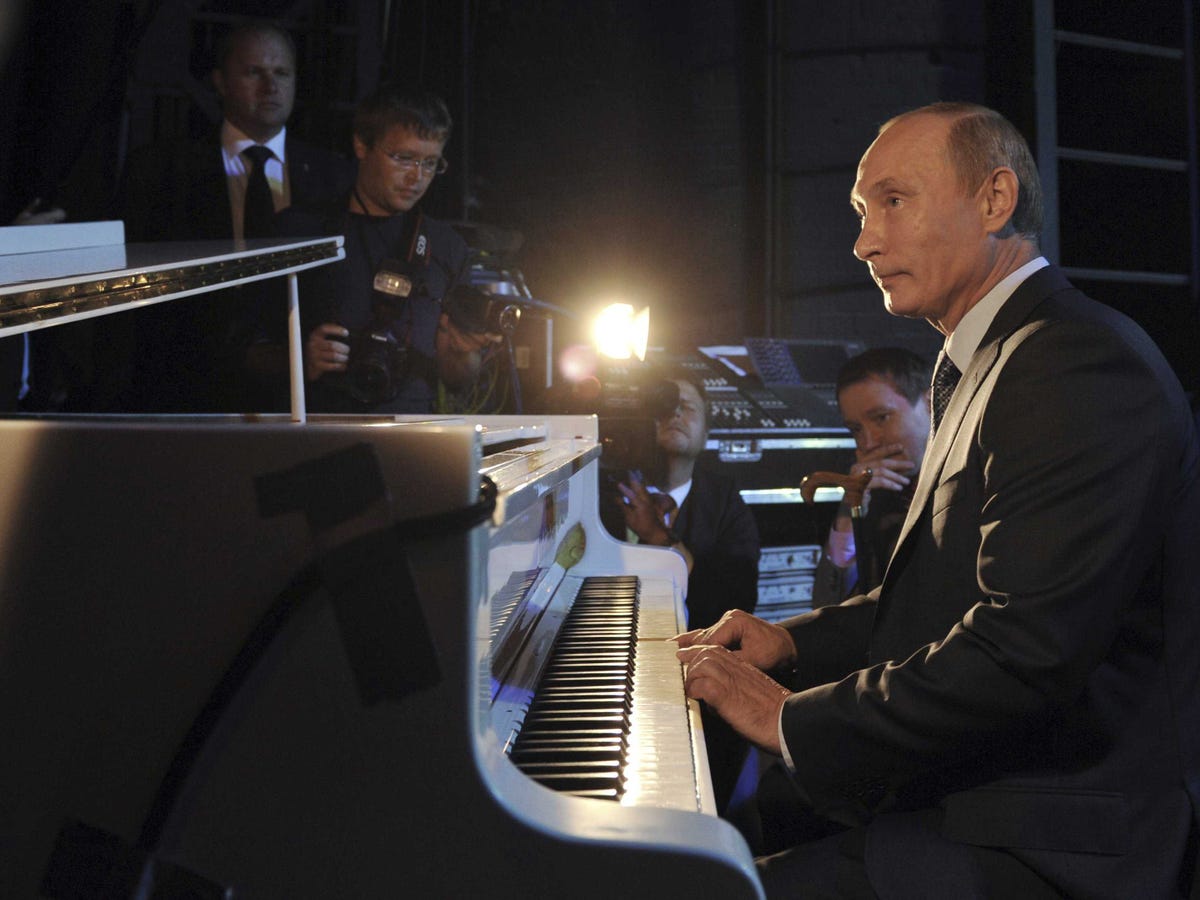 still-theres-a-lot-more-to-putin-than-shooting-animals-with-tranquilizer-guns-while-shirtless-putin-tickles-the-ivories-for-a-crowd-at-the-theatre-of-nations-in-moscow-he-often-plays-the-patriotic-song-from-what-the-motherland-begins-and-the-anthem-of-saint-petersburg-his-hometown-jam.jpg