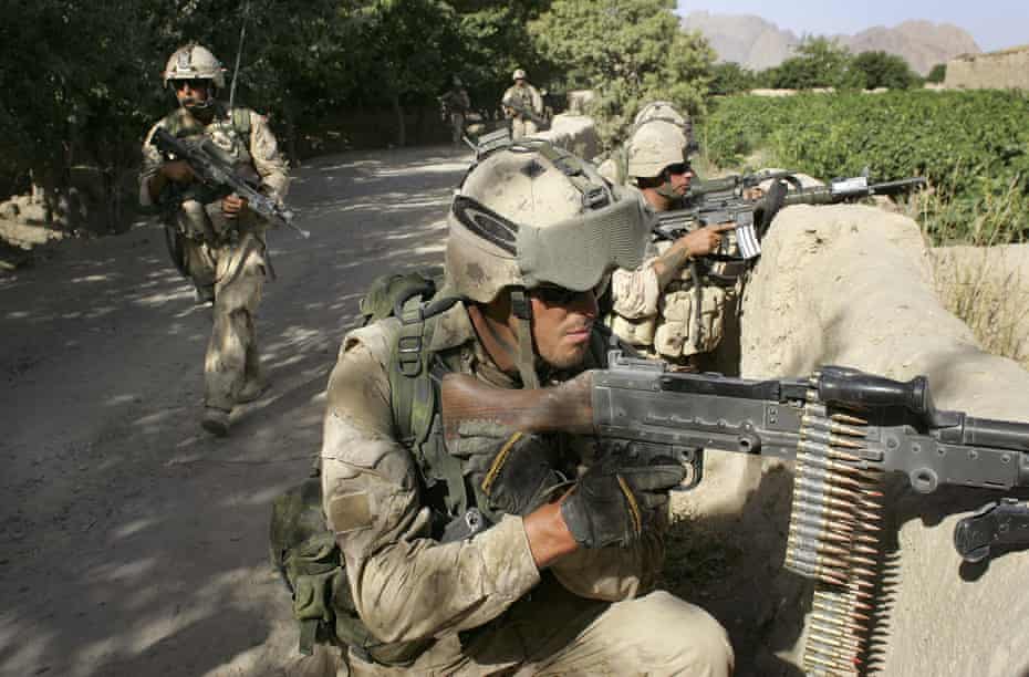 Canadian army forces take positions during a sweep for Taliban fighters June 14, 2006 in Panjwai.